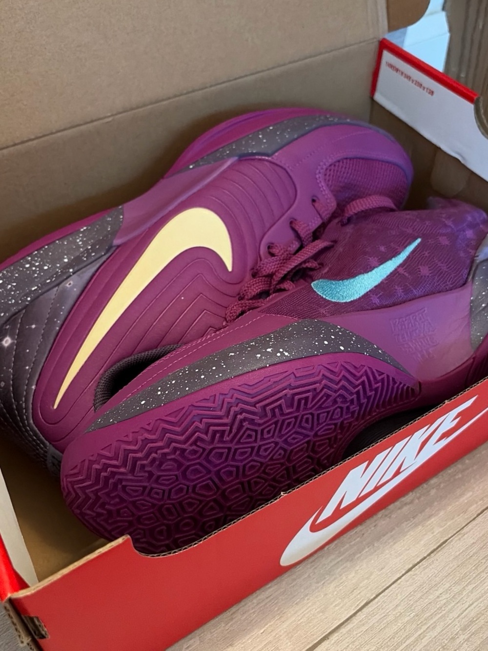 Nike Purple Athletic Shoes with Teal and Cream Swooshes